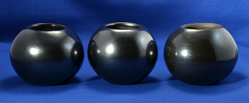 04 - Maria Martinez, Trio of Maria Martinez Pottery, Maria Poveka: THREE Polished Blackware Jars (3" ht x 4.25"d)
Hand coiled clay pottery