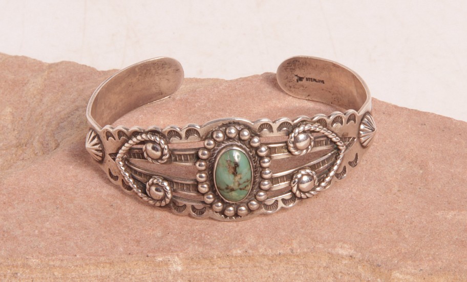 07 - Jewelry-Old, Harvey Style Navajo Cuff Bracelet: One Green Turquoise Setting, Twistwire, Beading, Triangle and Arrow Motifs (5.25" + 1.25" gap)
c. 1920, Sterling silver