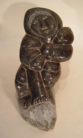 10 - Pacific Northwest, Large Steatite, soapstone carving;  Eskimo with fish figure.
1980